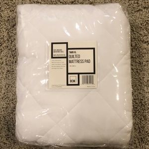 NWT Twin XL quilted mattress cover.